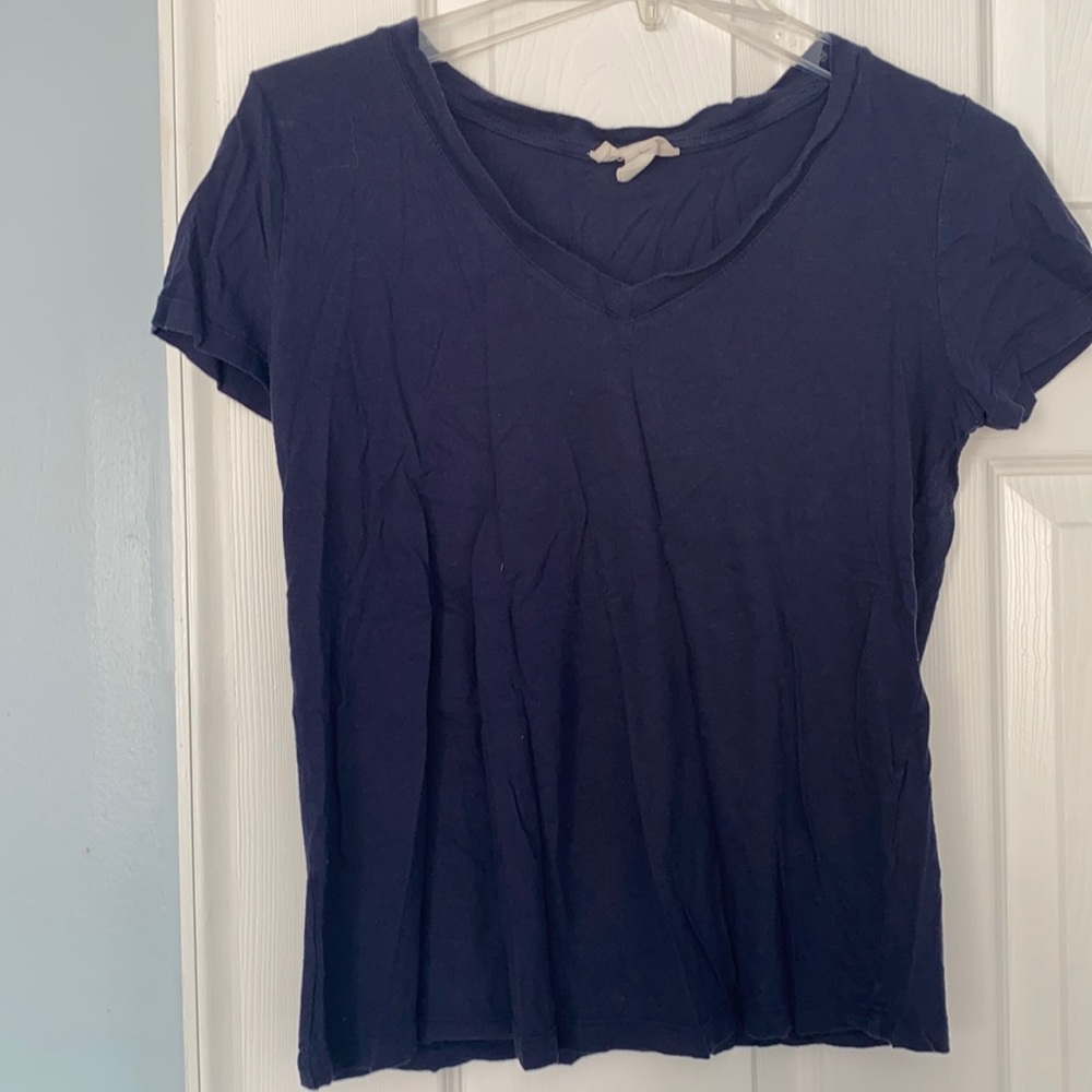 Multiple of the same shirt in different colors.